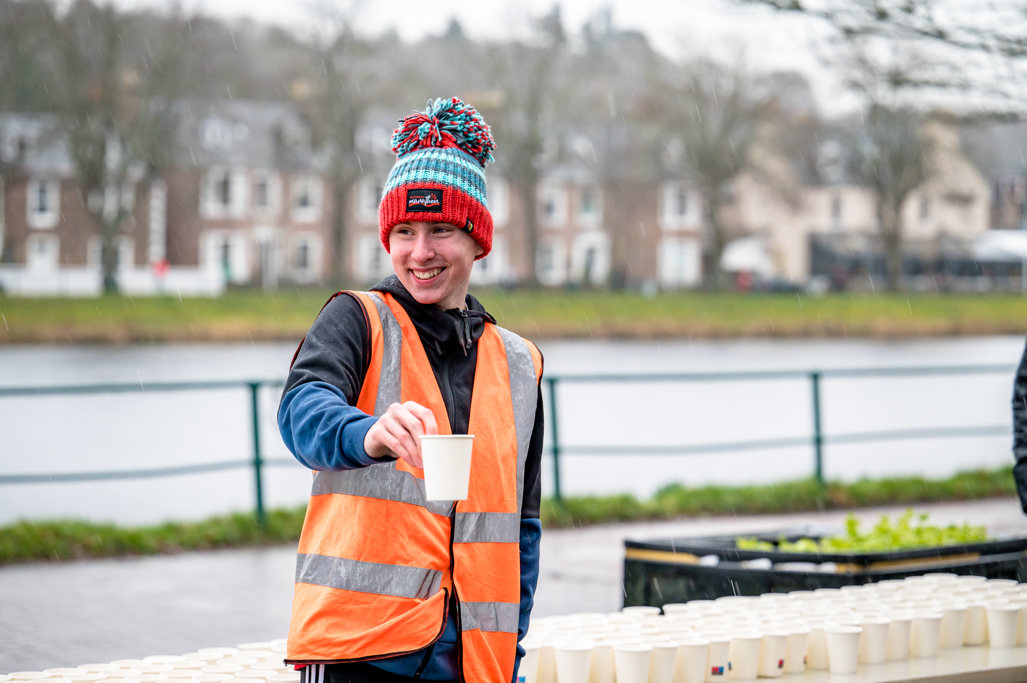 Volunteer handing out water