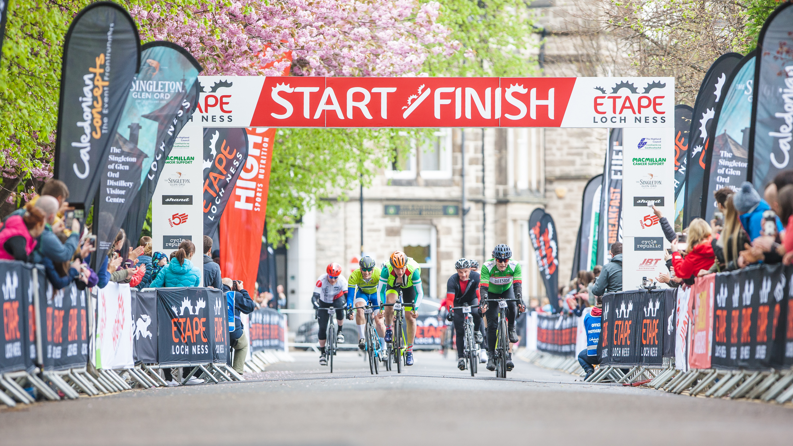Spectators cheer on riders 