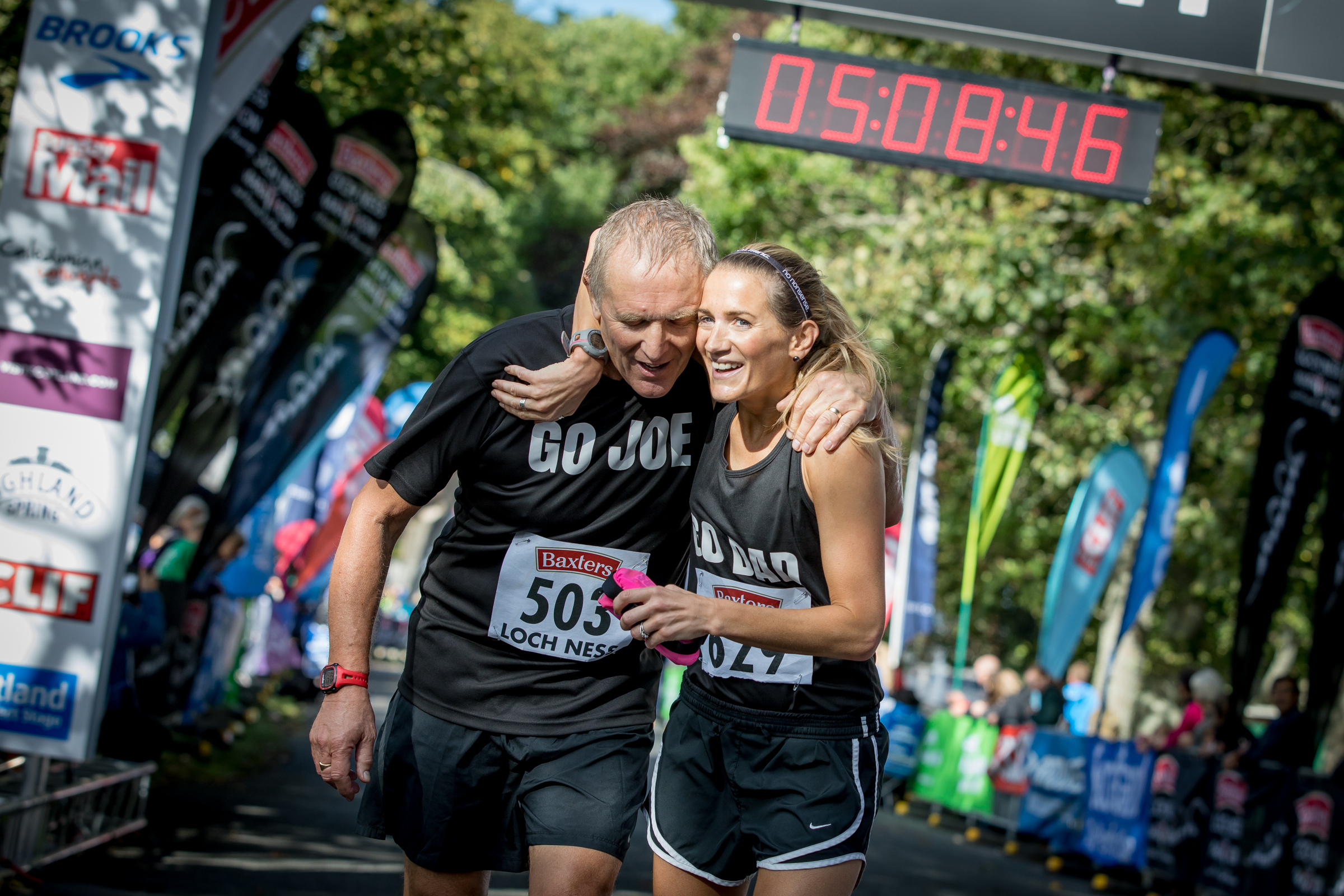 Runner cuddle at the Finish Line