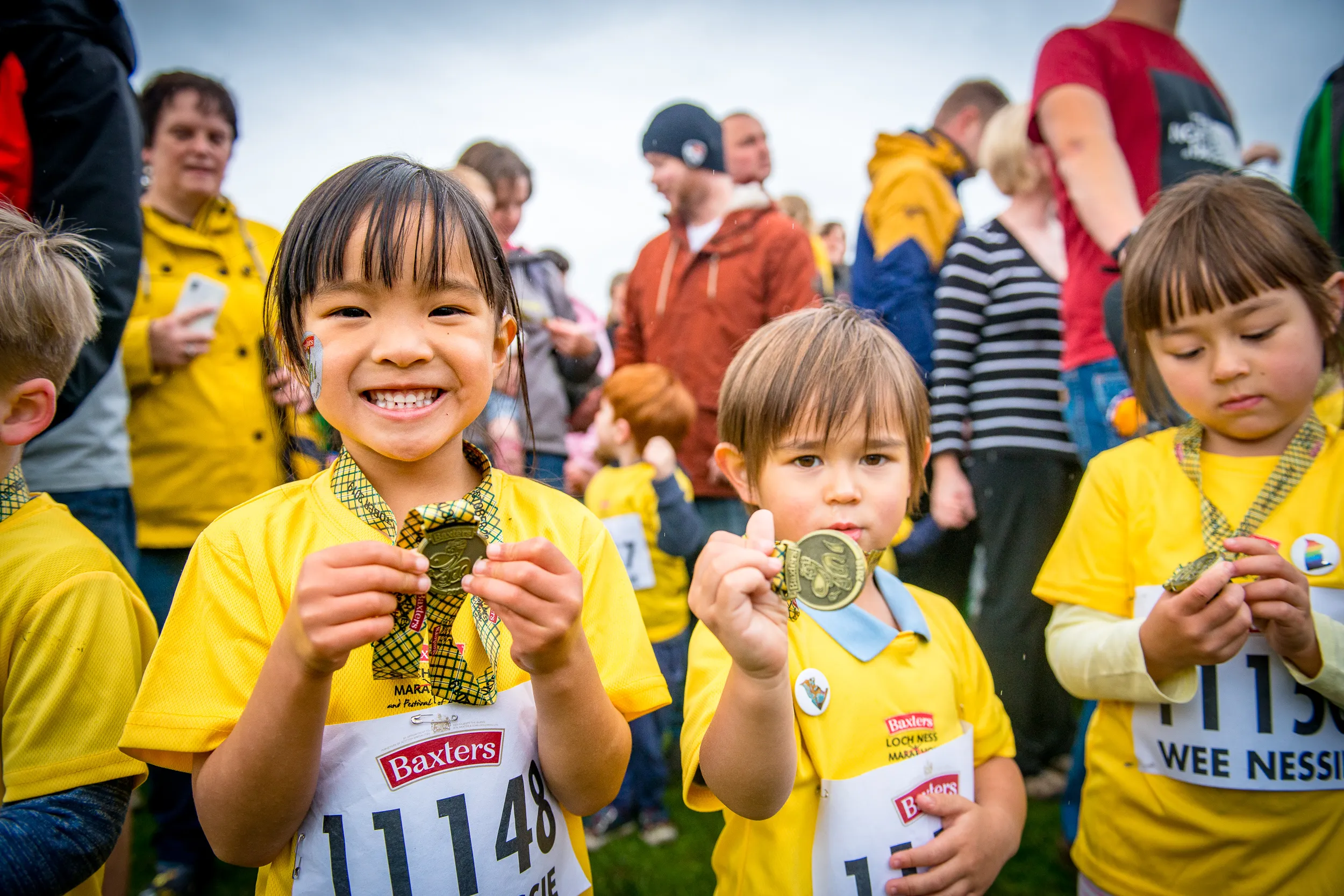 Children hold up their Wee Nessie medals 